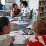 Uno dei progetti di supporto scolastico per minori alla casa della carità (foto Marco Garofalo)